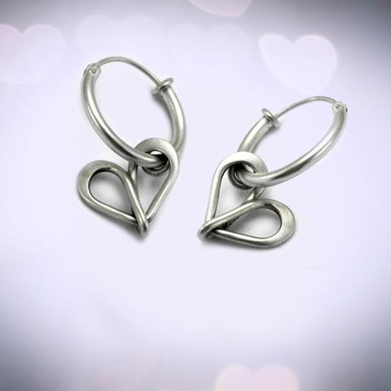 Endless Love infinity loop inspired  silver jewellery collection rings earrings pendants necklaces cufflinks chains by Annika Rutlin high quality unique and unusual solid sterling silver designer jewellery handmade in the UK