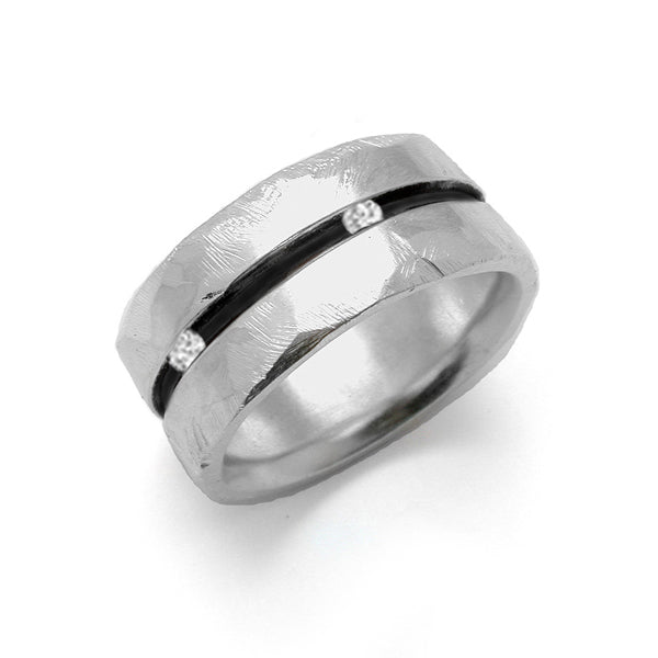 Wide grooved band ring from Annika Rutlin's Ixion collection. Adapted as requested by a client wanting channel set diamonds to add a subtle white sparkle contrasting with the dark oxidised groove within the ring. Rugged textured mans ring