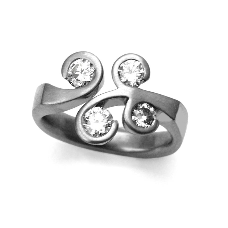 Unique, bespoke platinum and diamond 4 stone ring commission with swirl settings made by designer jeweller Annika Rutlin especially for a highly valued customer. High quality G Vs1 diamonds with a soft matt surface finish create an elegant right hand ring