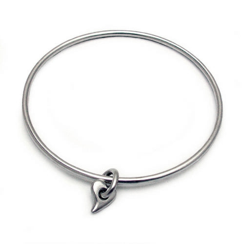 Annika Rutlin round silver bangle with hanging heart