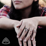 Annika Rutlin jewelry silver heart rings on models hands