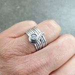 Annika Rutlin customer hand image multi ring paisley swirl silver ring set with white sapphire