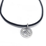 decorative stylised dragon disc pendant in sterling silver on leather by Annika Rutlin jewellery