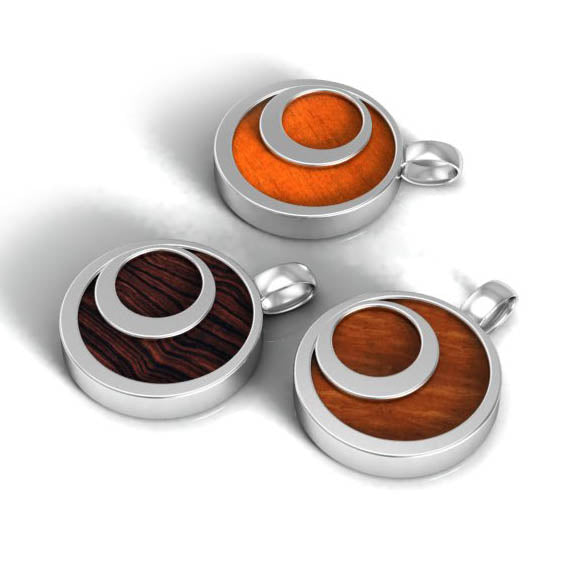 Set of three wooden and sterling silver pendants designed as unusual bridesmaid gifts with a natural earthy theme. 3 different types of would allowed for various colour combinations contrasting beautifully with silver and each piece person specific 
