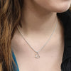 Annika Rutlin small silver endless love infinity heart pendant necklace on model
