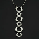 Annika Rutlin long tumbling shaped silver pendant