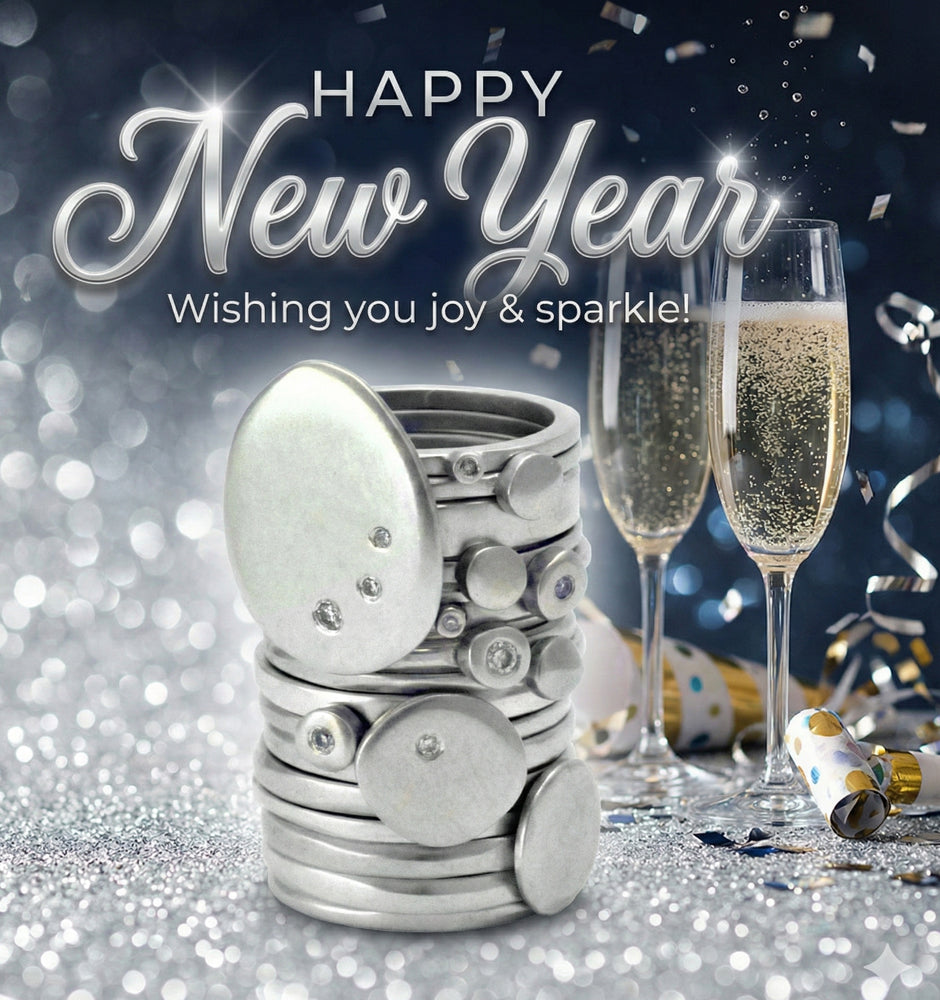 Happy New Year card with champagne glasses, silver egg, and confetti on a glittery background.