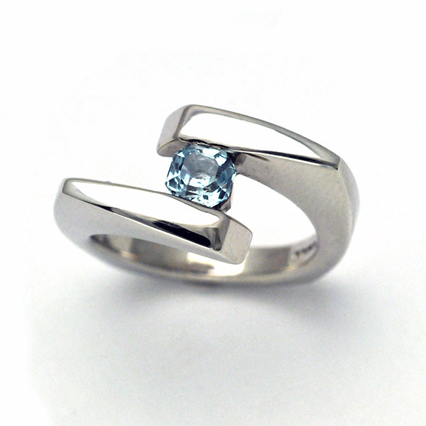 Customer commission octagonal shaped aquamarine gemstone in response to request for an unusual attractive piece of jewelery. Solid Sterling silver chunky angled band adapted from the Cirque Collection to create a specific look for our client