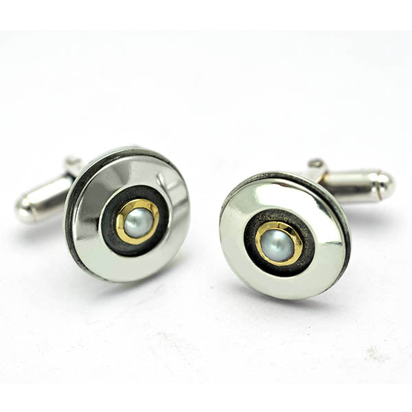 Unique freshwater pearl, gold and silver cufflinks created bespoke as a graduation gift. Pearl was used to represent the June birthstone of the wearer creating a meaningful piece of jewelry to be treasured for life. Highly polished 925 sterling silver 