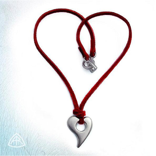 Annika Rutlin solid silver Luckenbooth heart pendant on red suede by jeweller Annika Rutlin