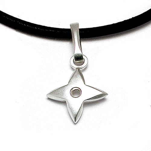 Annika Rutlin peaceful cross star pendant on leather