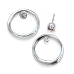 seperate white sapphire 4mm stud and silver circle jacket by Annika Rutlin