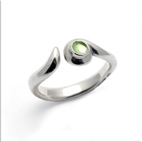 Annika Rutlin matt finish peridot gemstone swirl ring from the Kindred collection and birthstone for August