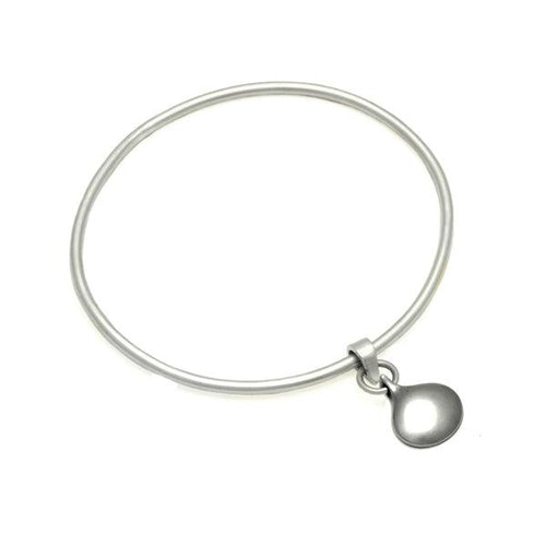 Reversible solid silver patterned or plain droplet bangle by Annika Rutlin