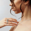 touching jewellery model image featuring sleek silver designs by Annika Rutlin jewellery