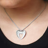 Annika Rutlin heart shaped angel wings pendant solid silver on model
