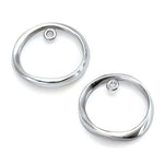 Silver circle ear sleeves for layered earrings look by jeweller Annika Rutlin