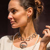 Catwalk odel wearing Annik Rutlin Raven collection large necklace and hoop earrings