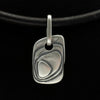 alternative dog tag jewellery with layered texture made from solid silver on leather