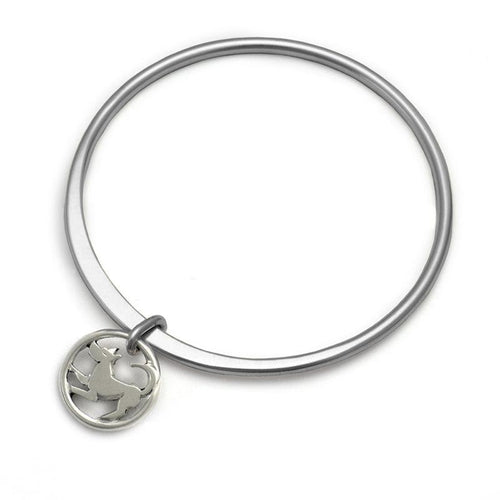 Forged solid silver round bangle with dog charm by Annika Rutlin
