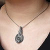 Annika Rutlin long winged angel pendant in solid silver on model
