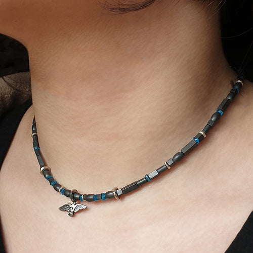 Annika Rutlin hematite beaded necklace with raven pendant on model