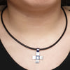 Annika Rutlin solid silver Saracen collection cross on leather on model