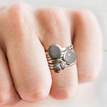 Annika Rutlin silver pebble like stacking rings on hand model