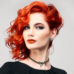 stunning red headed model wearing heart jewelry by Annika Rutlin