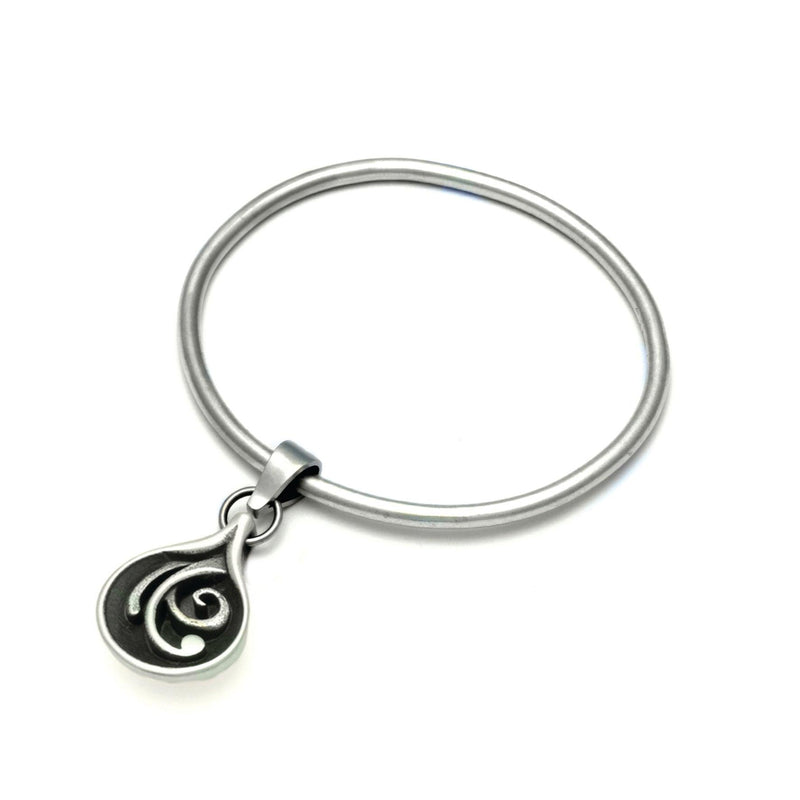 swirly silver patterned tear droplet bangle from the Monsoon Collection