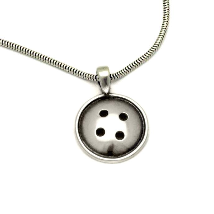 Sterling silver button pendant by jewellery designer Annika Rutlin