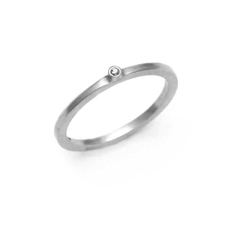 delicate small single white diamond silver band ring Annika Rutlin