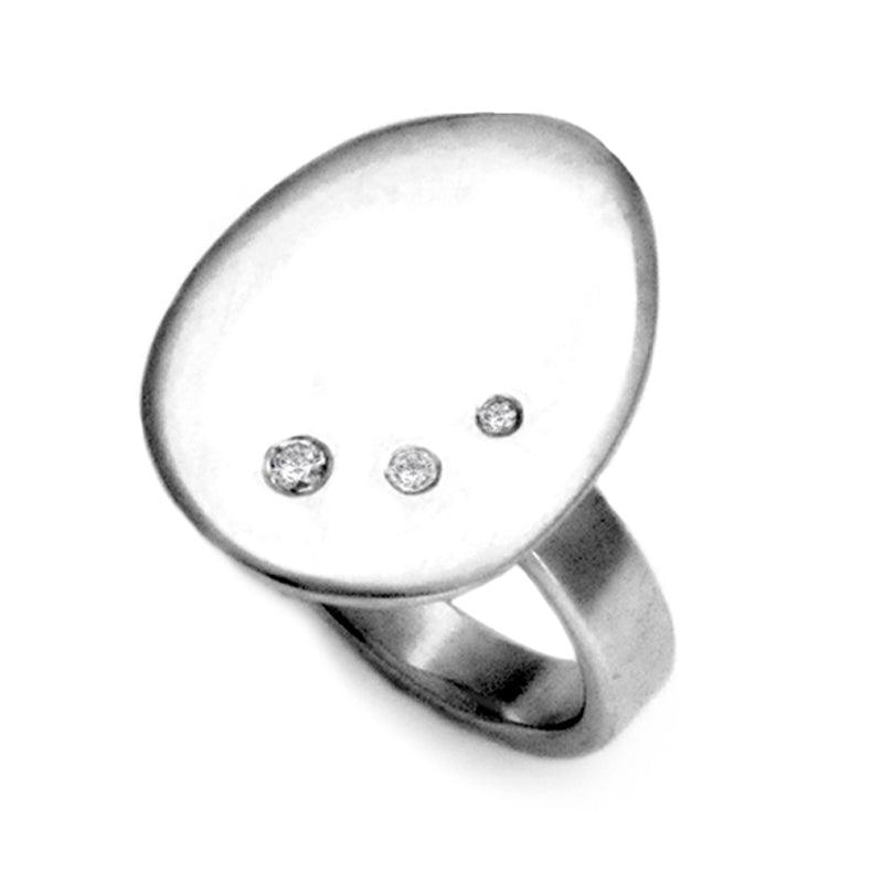 Large tactile pebble like silver ring set with 3 diamonds by Annika Rutlin
