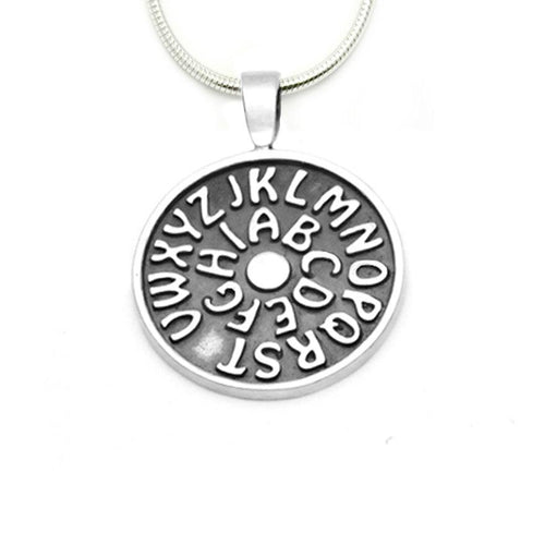 Sterling silver alphabet disc pendant with missing U by Annika Rutlin
