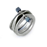 Annika Rutlin alternative stacking ring in sterling silver connected by hematite tiped beads