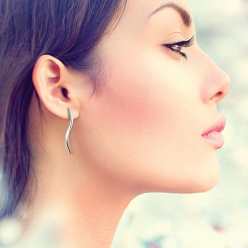 serene and striking simple silver wave stud earrings by designer Annika Rutlin