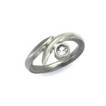 Solid silver wrap ring set with 4mm white saphire by Annika Rutlin